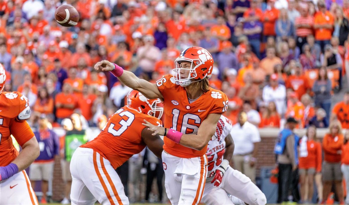 Clemson quarterback Trevor Lawrence hands the ball off to Travis Etienne  during the first half of an NCAA college football game against Duke  Saturday, Nov. 17, 2018, in Clemson, S.C. Clemson won