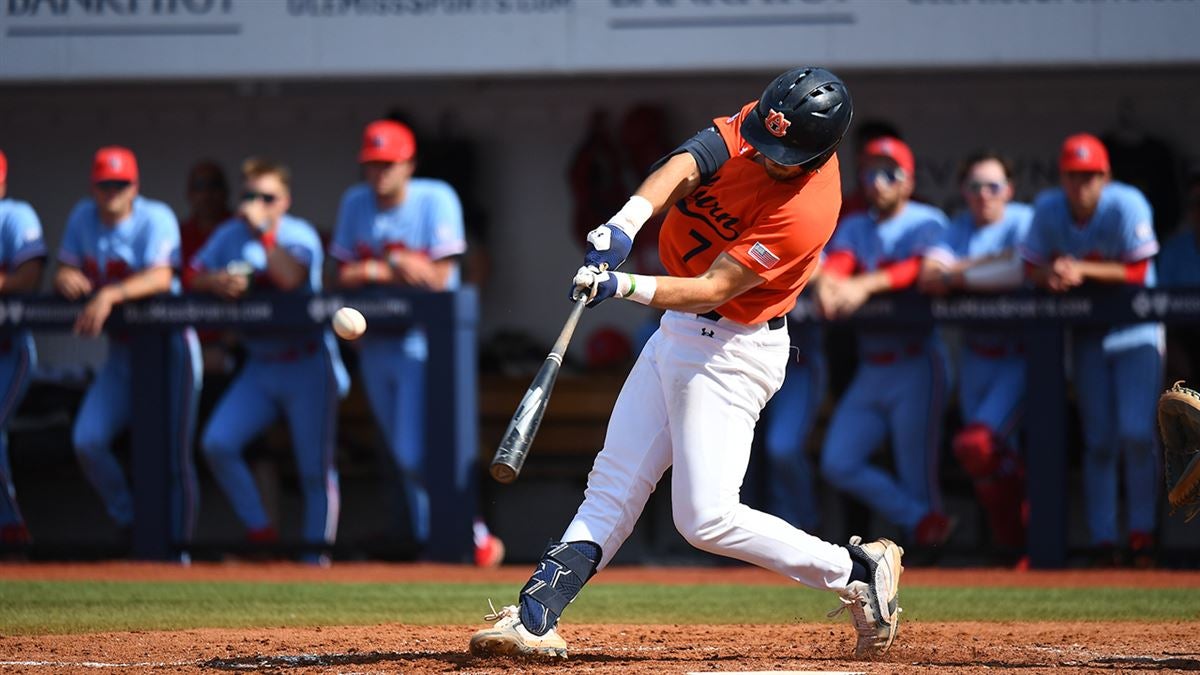 Auburn infielder Cole Foster (7) runs to first after hitting a