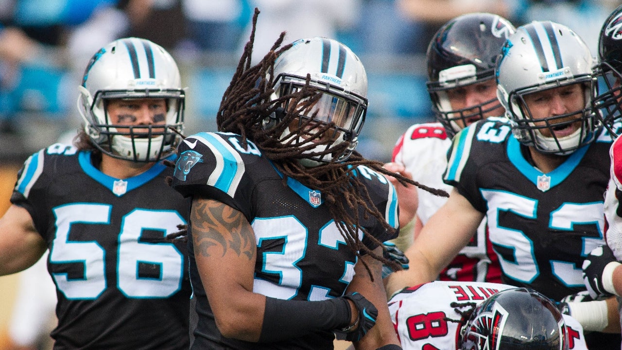 Carolina Panthers' Cam Newton (1) and A.J. Klein (56) react to the teams'  scoring against the Miami Dolphins in the sec…