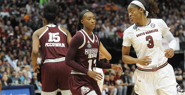 South Carolina head coach Dawn Staley hugs A'ja Wilson, left, as Wilson  leaves the game during the second half of a regional final against  Connecticut at the a women's NCAA college basketball