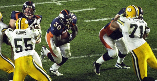 Denver Broncos running back Terrell Davis rushes past the News