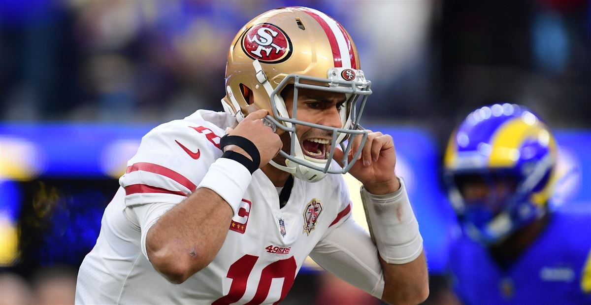 Las Vegas Raiders quarterback Jimmy Garoppolo (10) wipes away