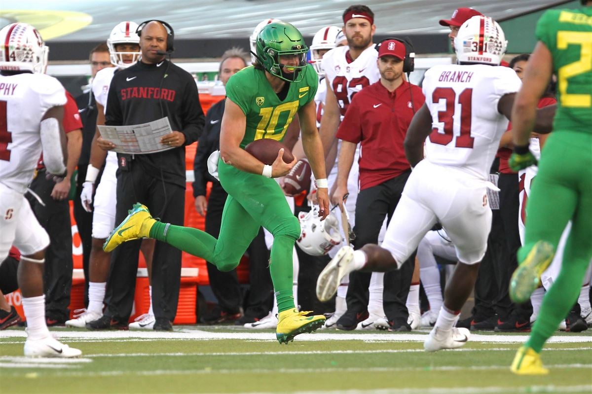 Hollywood, CA. 24th July, 2019. Oregon Ducks quarterback Justin Herbert  poses for a photo in front of the Rose Bowl and National Championship  trophies at the Pac-12 football media day on Wednesday