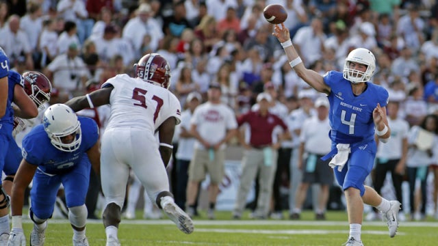 Georgia State quarterback Nick Arbuckle, center, runs for yardage past the  New Mexico State defense during the first half of an NCAA college football  game in Las Cruces, N.M., Saturday, Sept. 12