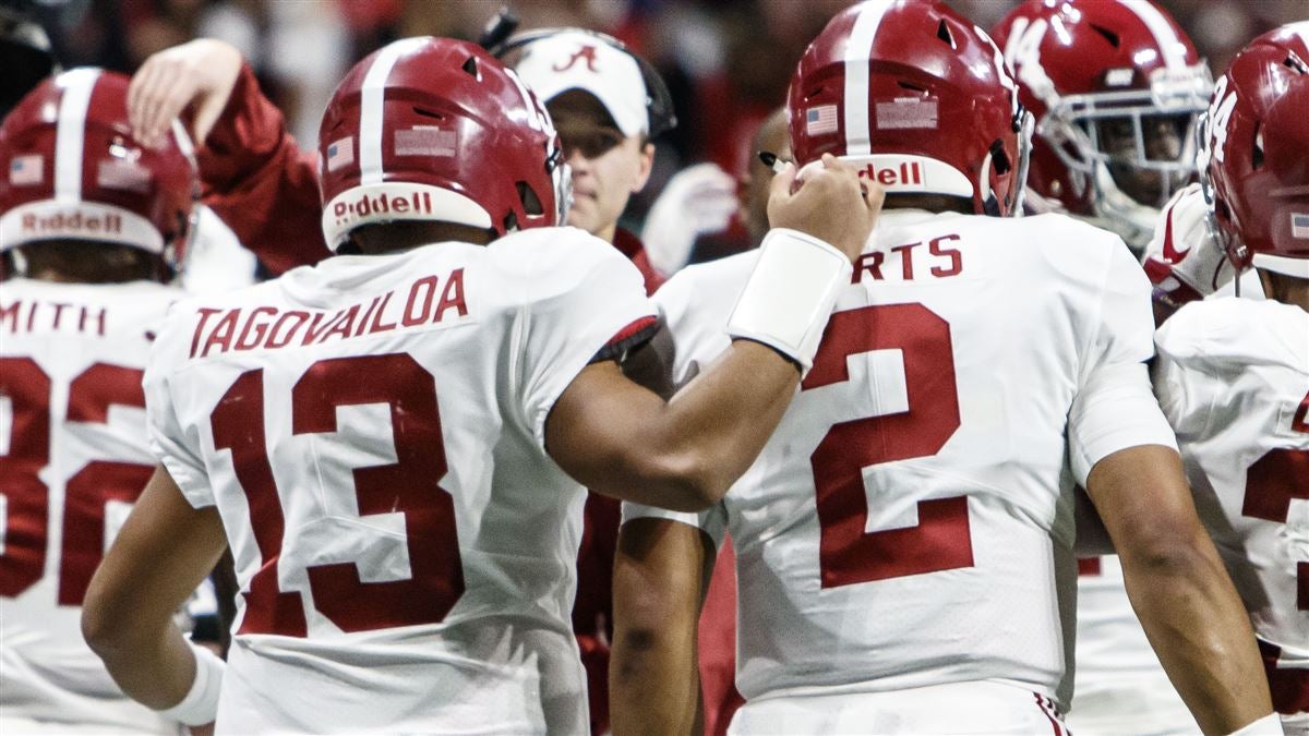 Alabama's Jalen Hurts (2) is seen on the bench with Tua Tagovailoa (13)  head coach Nick Saban during the second half of the NCAA college football  playoff championship game against Georgia Monday, …