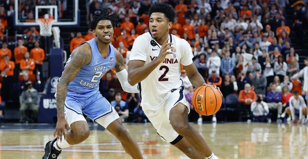 Charlottesville, Virginia, USA. 24th Jan, 2022. Louisville Cardinals guard  Mason Faulkner (11) shoots over Virginia guard Kihei Clark (0) during NCAA  basketball game between the Virginia Cavaliers and the Louisville Cardinals  at