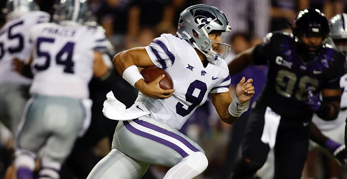 Detroit Lions quarterback Adrian Martinez (18) keeps the ball