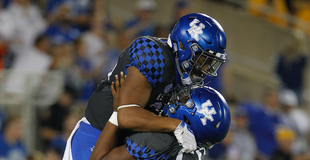 Cats win dog fight with Tigers Cats win dog fight with Tigers