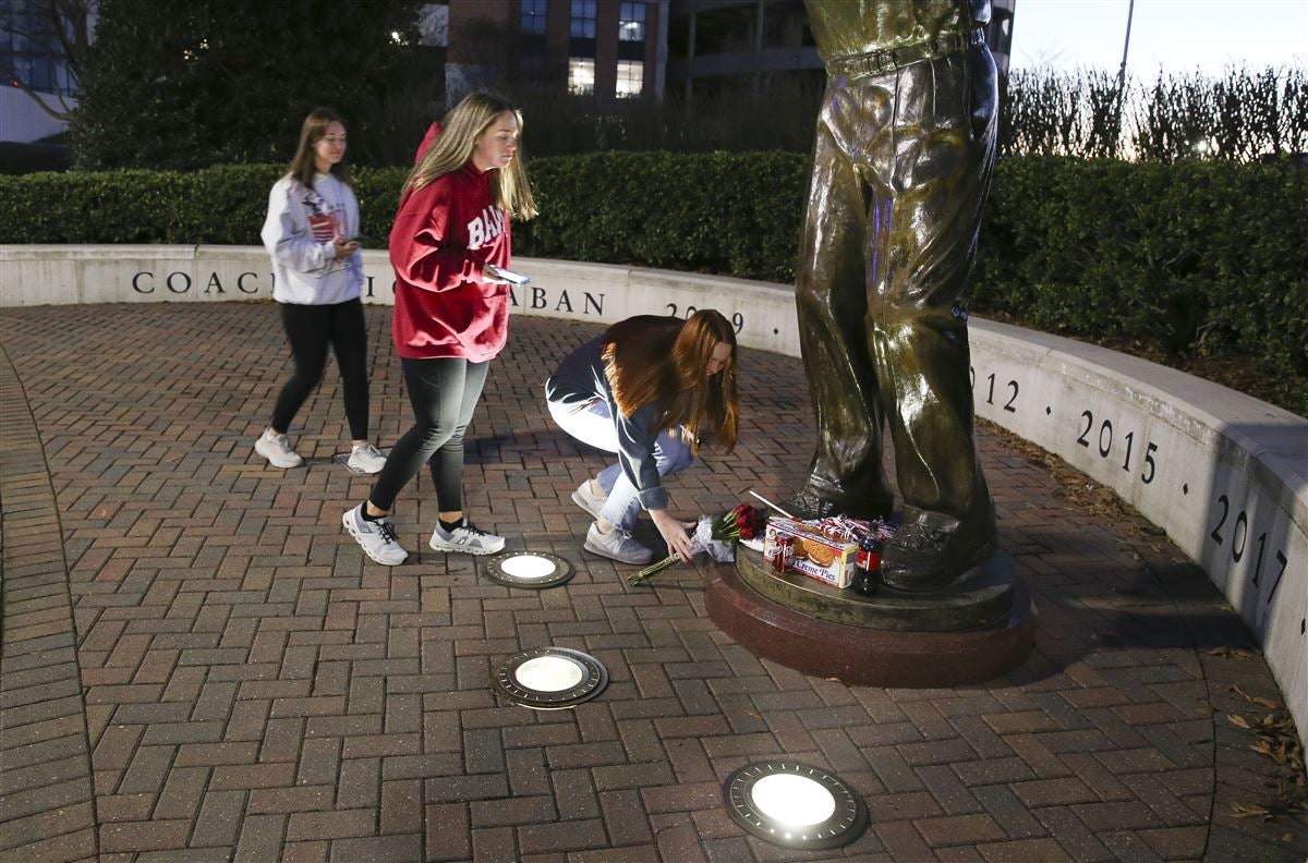 Nick Saban Retires Fans gather with gifts at Saban statue outside