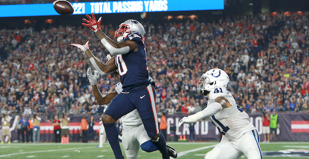 New England Patriots wide receiver Josh Gordon (10) gets a hug from  quarterback Tom Brady after the two connected for a touchdown reception in  the third quarter against the Minnesota Vikings at