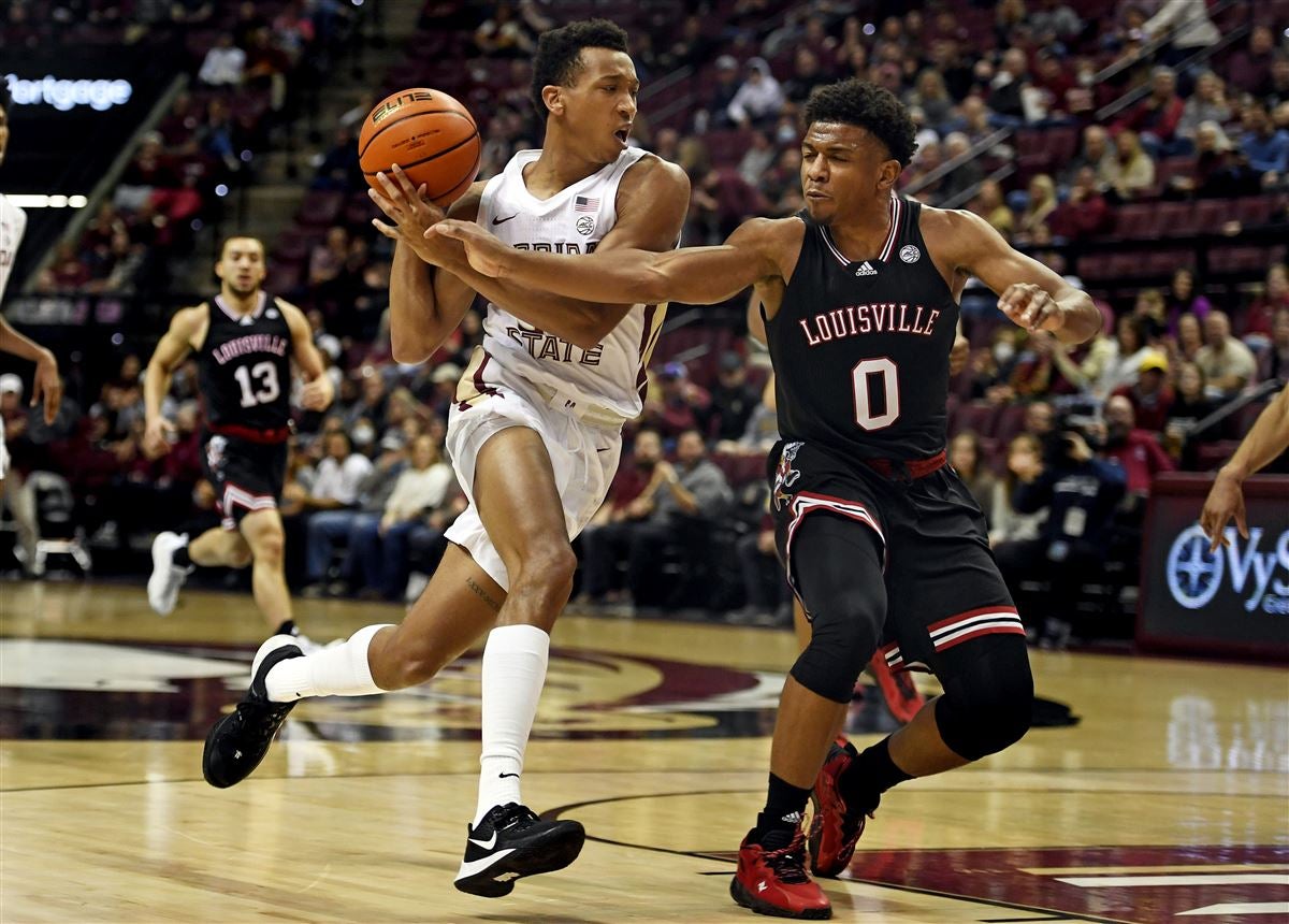 Mason Faulkner of the Louisville Cardinals brings the ball up court News  Photo - Getty Images