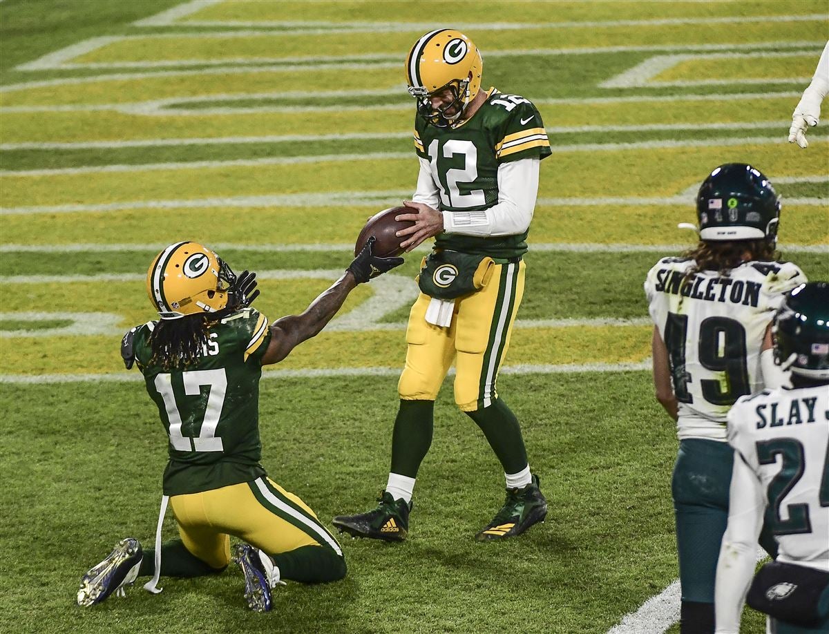 On a record-setting night at Lambeau Field, Rodgers, Adams make