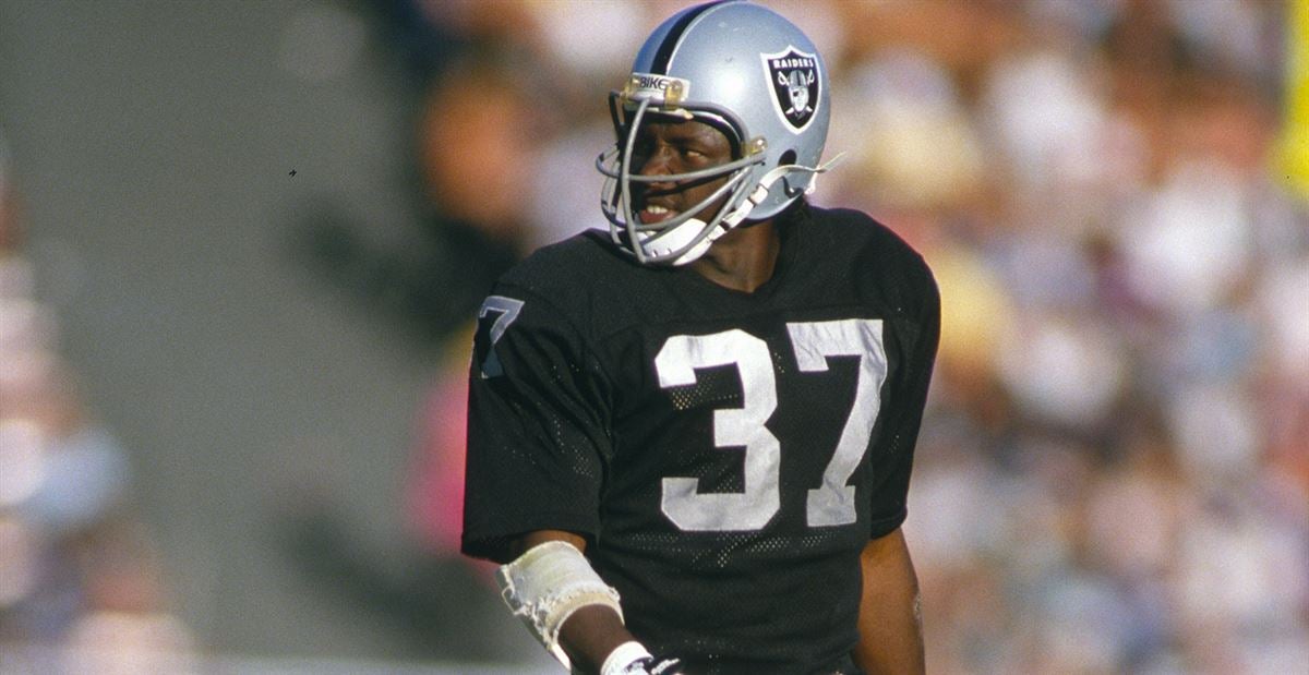 Oakland Raiders cornerback Lester Hayes has the football after