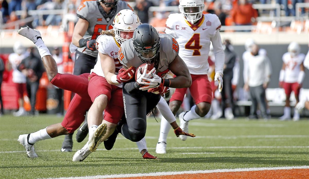 Oklahoma State's Spencer Sanders connects with Jelani Woods for 34