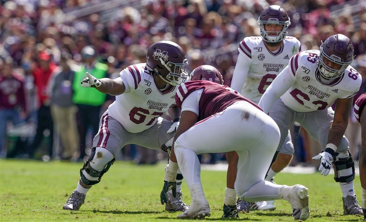 Mississippi State offensive tackle Charles Cross holds a team