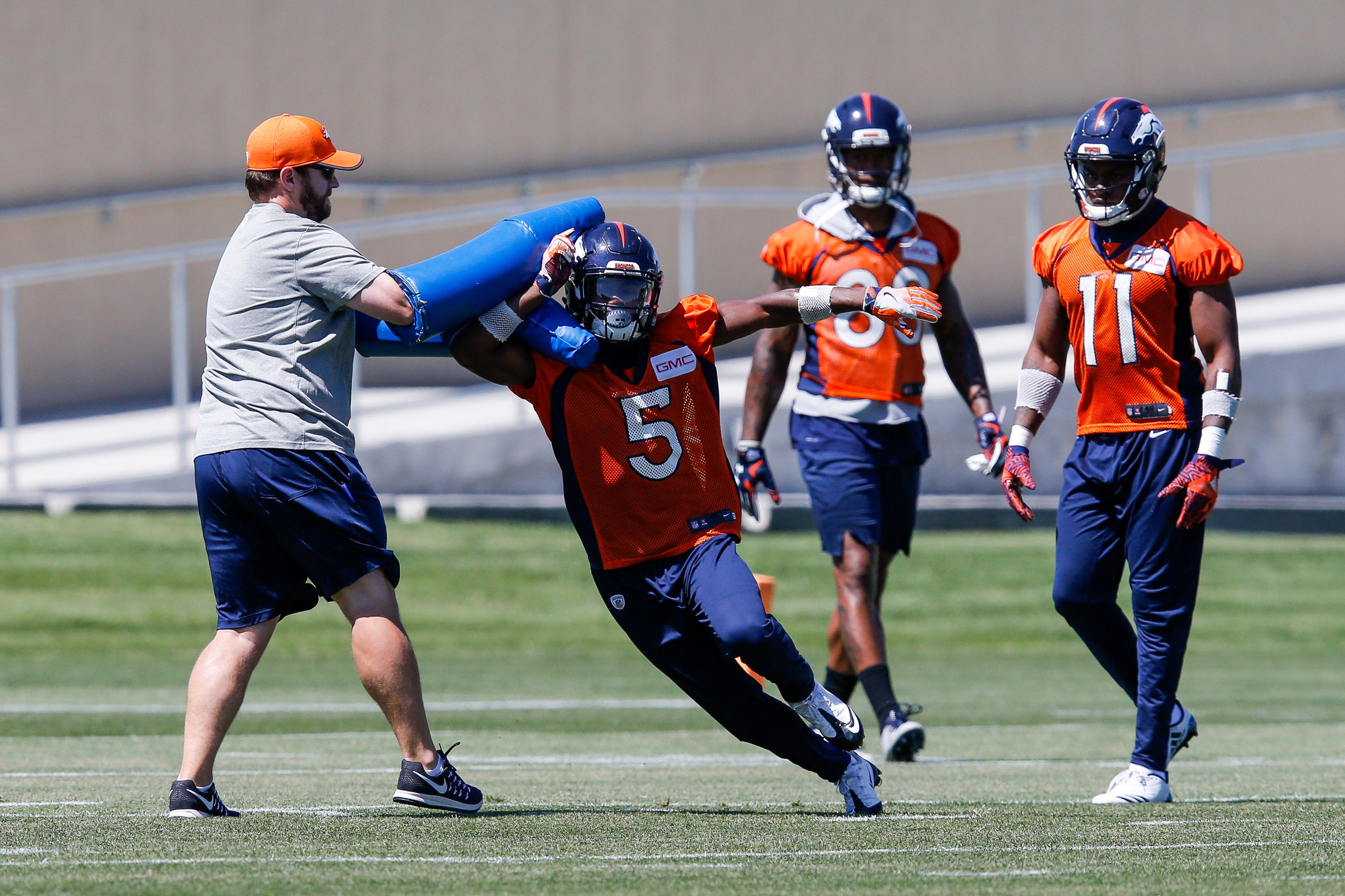 HC)Denver Broncos WR Brandon Stokley, left, mascot Miles, center