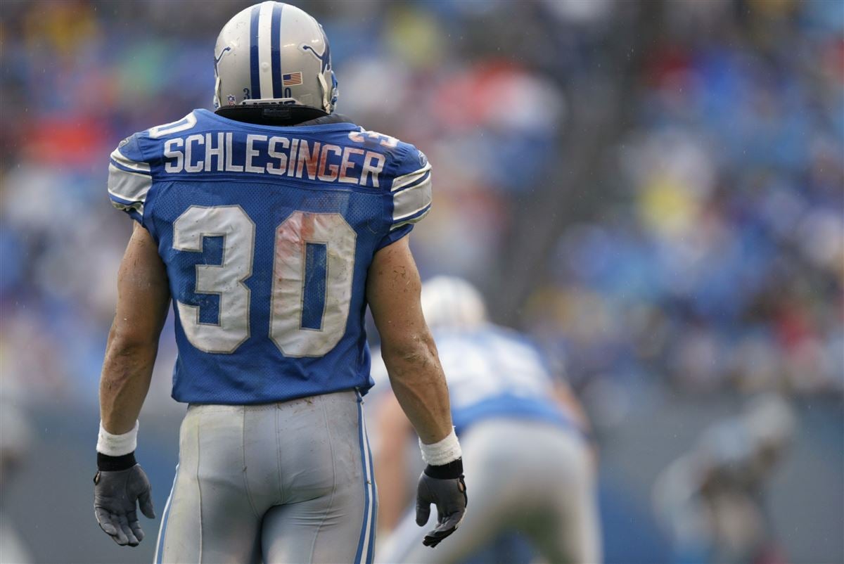 Detroit Lions fullback Cory Schlesinger (30) wears the new Detroit