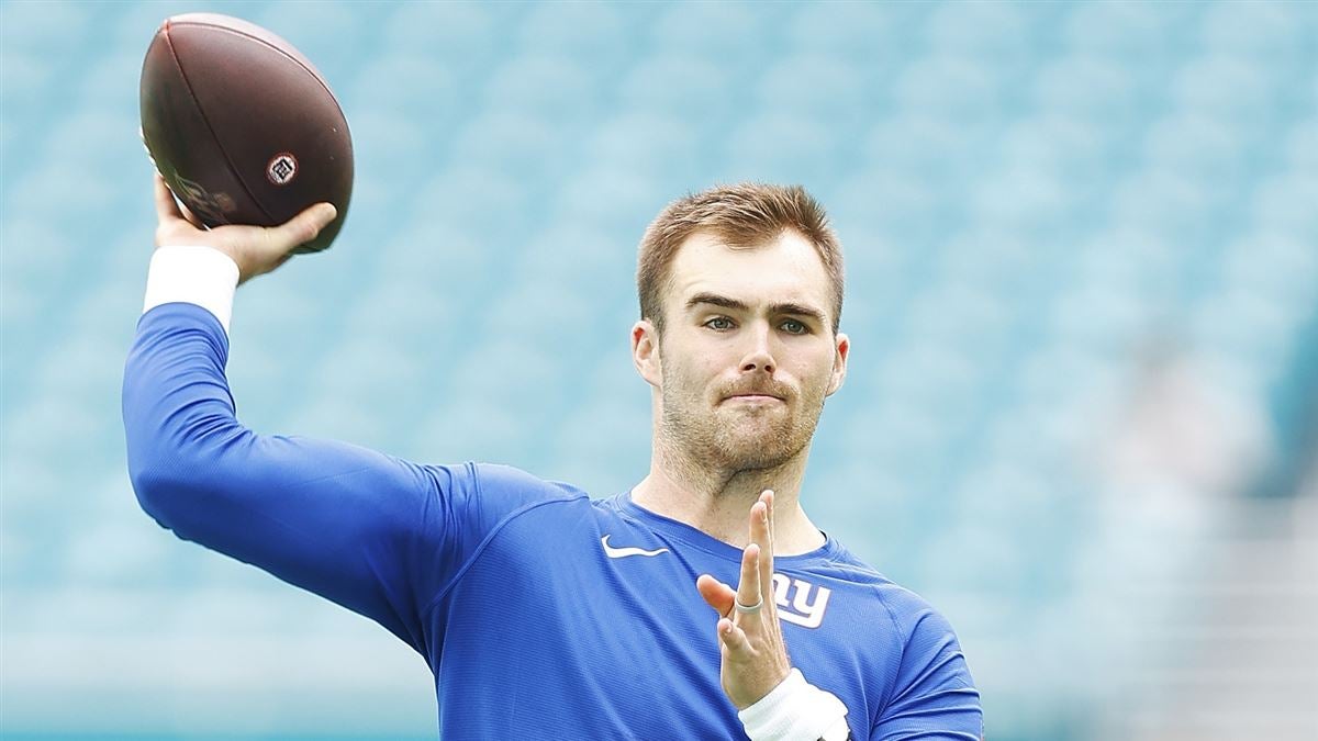 Washington Commanders quarterback Jake Fromm (11) looking down