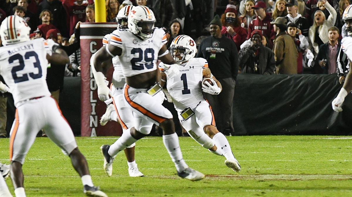 Bo Nix Auburn quarterback ankle injury surgery Iron Bowl out for