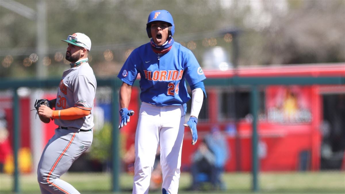 Florida infielder Josh Rivera (24) celebrates while running to