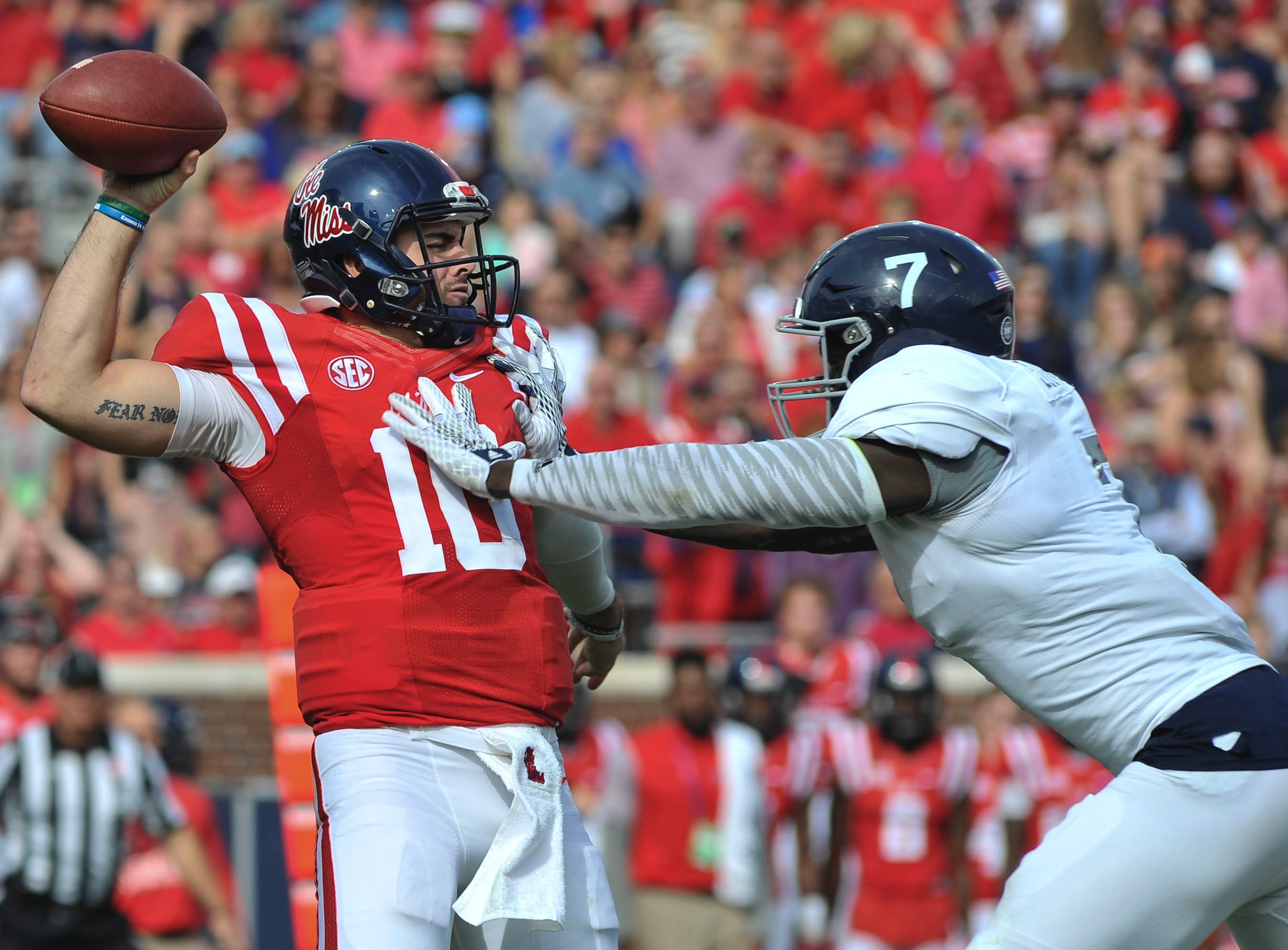 September 24, 2016: D'Andre Walker (15) Georgia Bulldogs linebacker hits  Jason Pellerin (7) Ole Miss Rebels quarterback as he passes during the game  between the Georgia Bulldogs and Ole Miss Rebels .