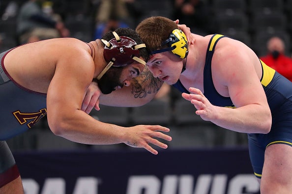 College notes: Led by three All-Americans, UM wrestling pins down