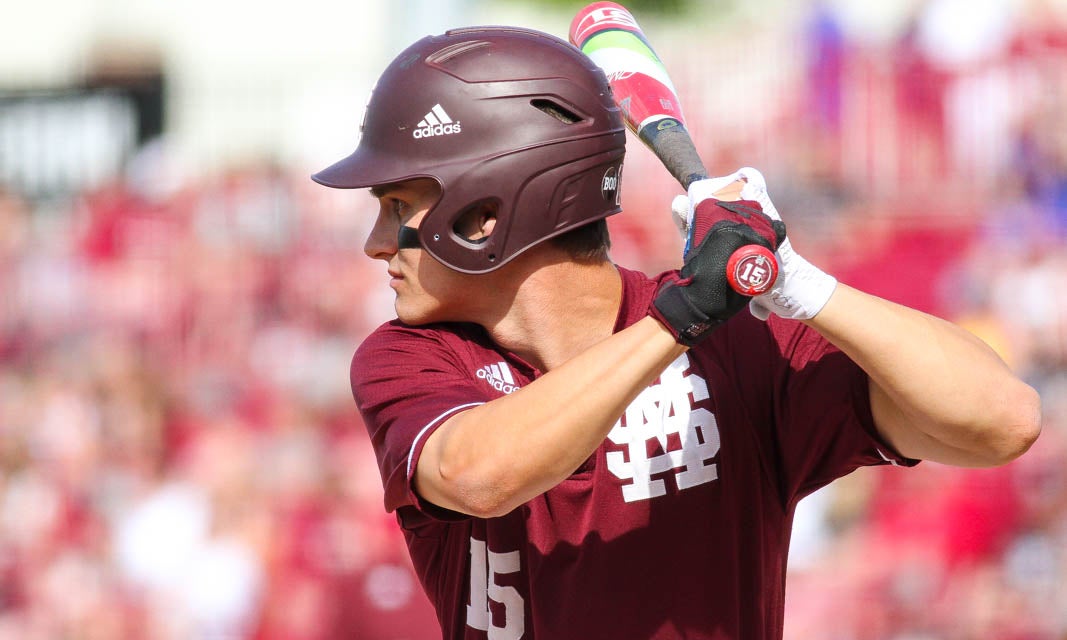 Mississippi State's Hunter Renfroe (34) is greeted by teammates