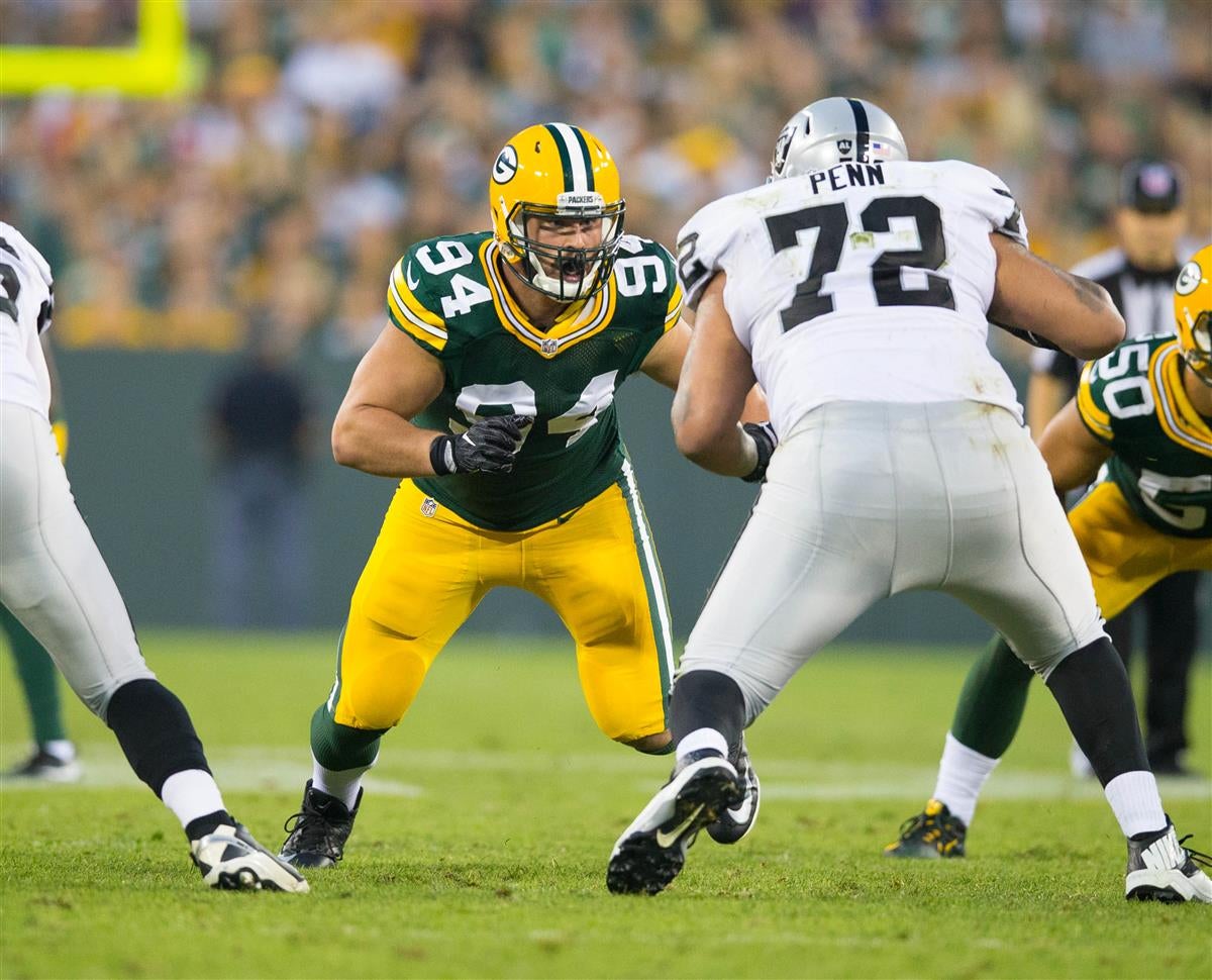 Green Bay Packers defensive end Dean Lowry (94) is blocked by Detroit Lions  offensive tackle Penei Sewell (58) during the first half of an NFL football  game Sunday, Nov. 6, 2022, in