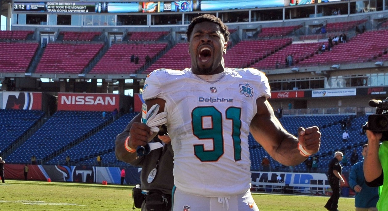 Center Mike Pouncey of the Miami Dolphins signals at the line of