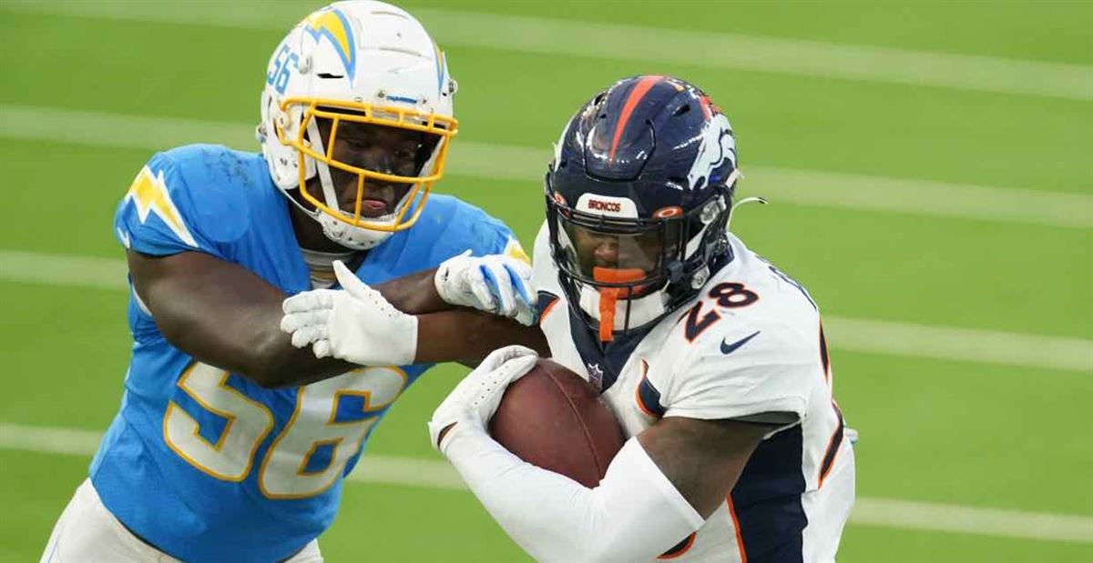 Denver Broncos running back LeVante Bellamy (32) chats with Denver Broncos  running back Royce Freeman (28) as they take part in drills during an NFL  football practice at the team's headquarters Monday