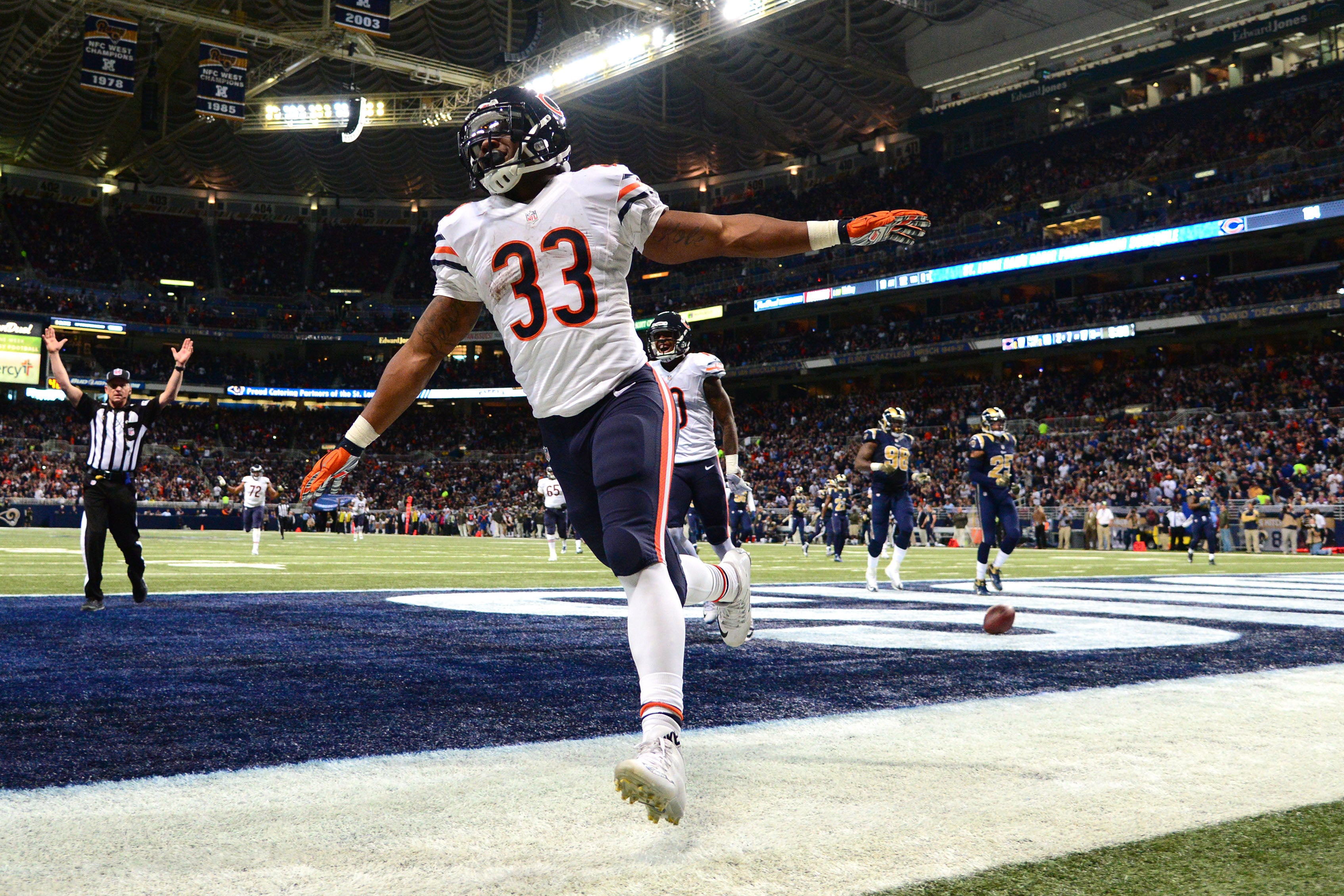 Detroit Lions running back D'Andre Swift (32) is brought down by Chicago  Bears linebacker Nicholas Morrow (53) during the first half of an NFL  football game in Chicago, Sunday, Nov. 13, 2022. (