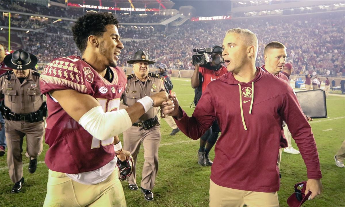 Heisman contending QB Mike Norvell and FSU headman MIke Norvell celebrate a victory
