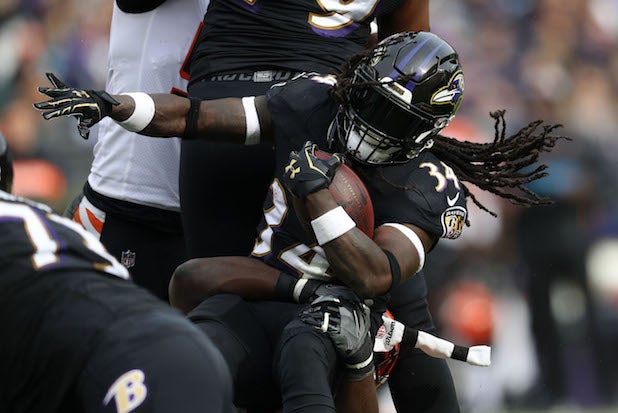 Why Running Back Alex Collins Wears a Super Dark Facemask Visor