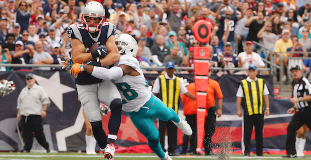 New England Patriots quarterback Tom Brady looks at the board during 2nd  half action, between the Miami Dolphins, and the New England Patriots  September 12, 2011 at Sun Life Stadium in Miami