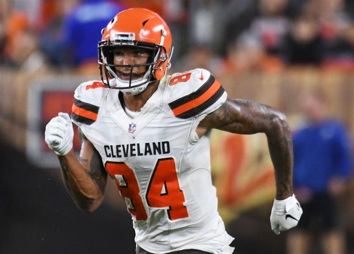 Cleveland Browns wide receiver Derrick Willies (84) holds off Cleveland  Browns defensive back Sheldrick Redwine (33) after a pass reception during  practice at the NFL football team's training facility Wednesday, July 31