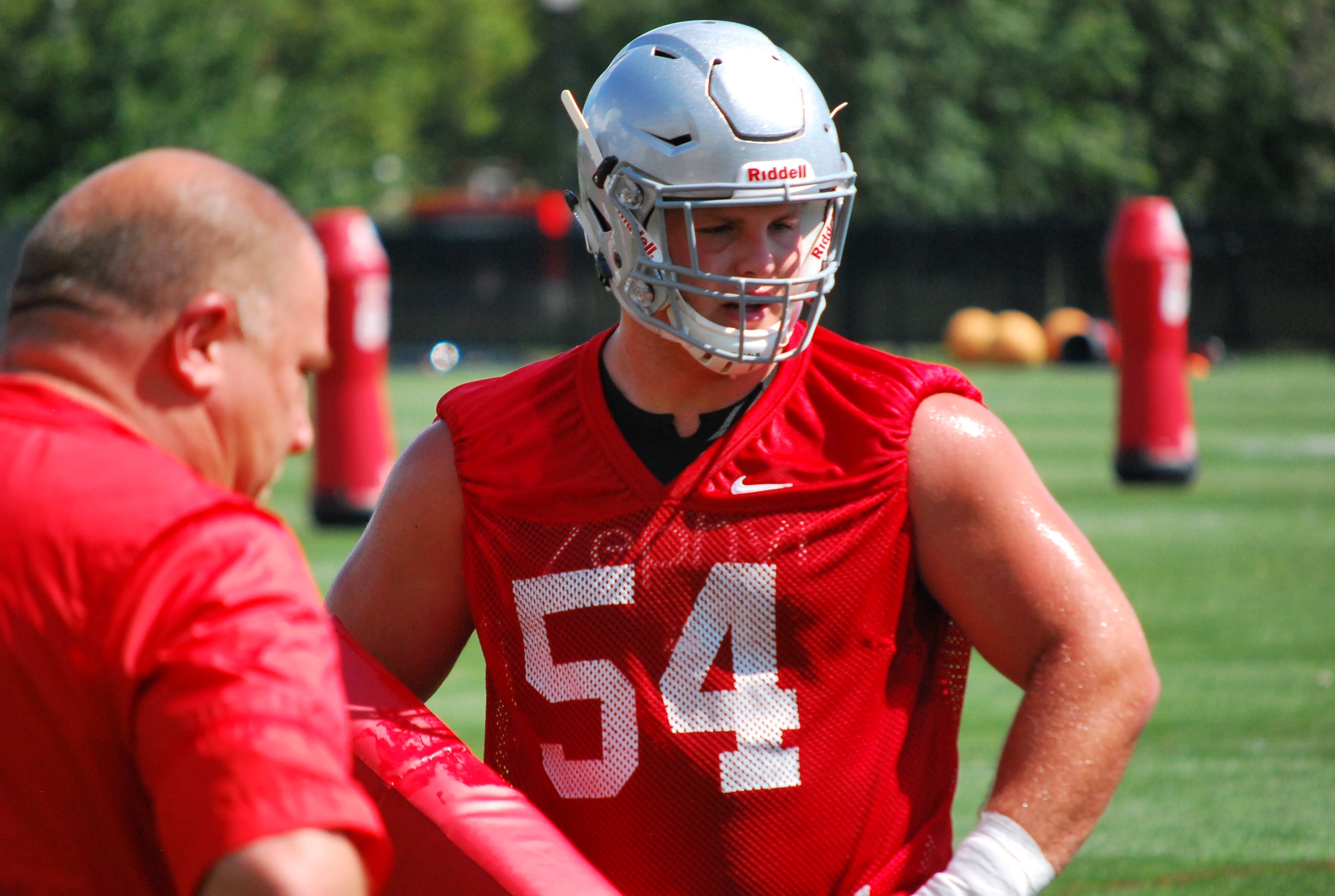 Picture of QB1 from first day of training camp. Rocking the red jersey and  even a visor on his helmet