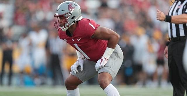 Washington State linebacker Daiyan Henley looks to the sideline