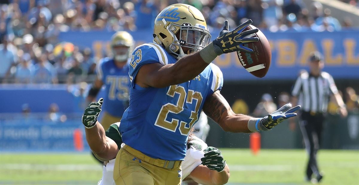 Bruins running back Demetric Felton J. gains yards on a run during