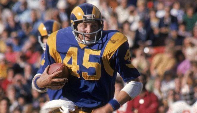 Jim Bertelsen of the Los Angeles Rams carries the ball against the