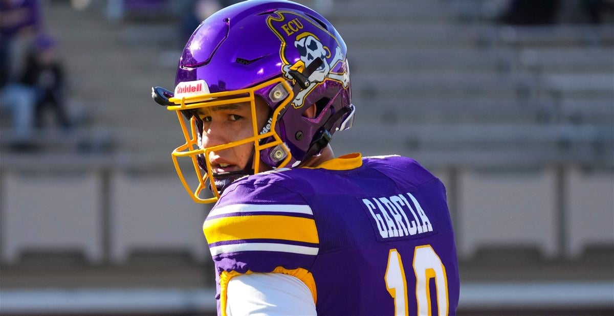 East Carolina quarterback Mason Garcia (10) runs against Navy