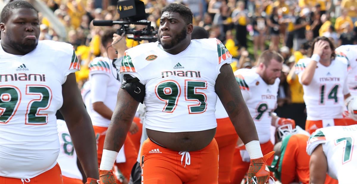 Miami Dolphins defensive tackle Anthony Moten (43) attempts to