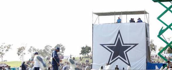 Jeff Heath climbs ladder from Lake Orion to Dallas Cowboys captain