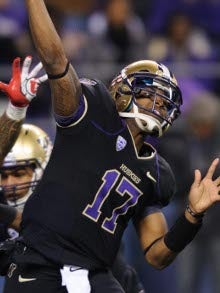 Washington quarterback Keith Price (17) hands off the ball to Bishop Sankey  (25) during second half of the MAACO Bowl NCAA college football game  against Boise State, Saturday, Dec. 22, 2012, in