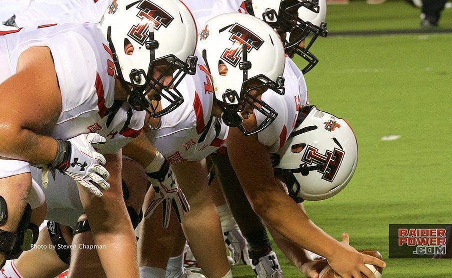 Patrick Mahomes Texas Tech Red Raiders Unsigned White Jersey Running with Ball vs. West Virginia Photograph