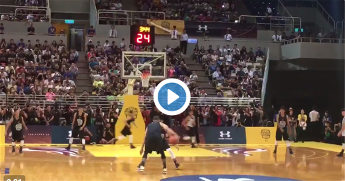 Stephen Curry has a potential buzzer-beater blocked by camper