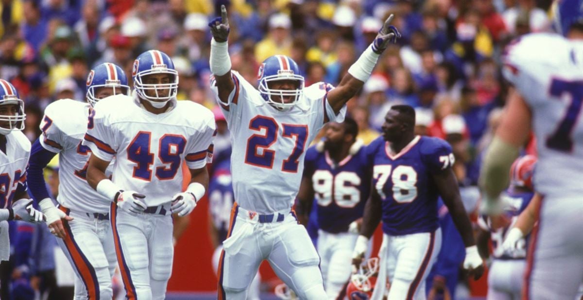 Denver Broncos safety Steve Atwater (27) jumps into the air in an