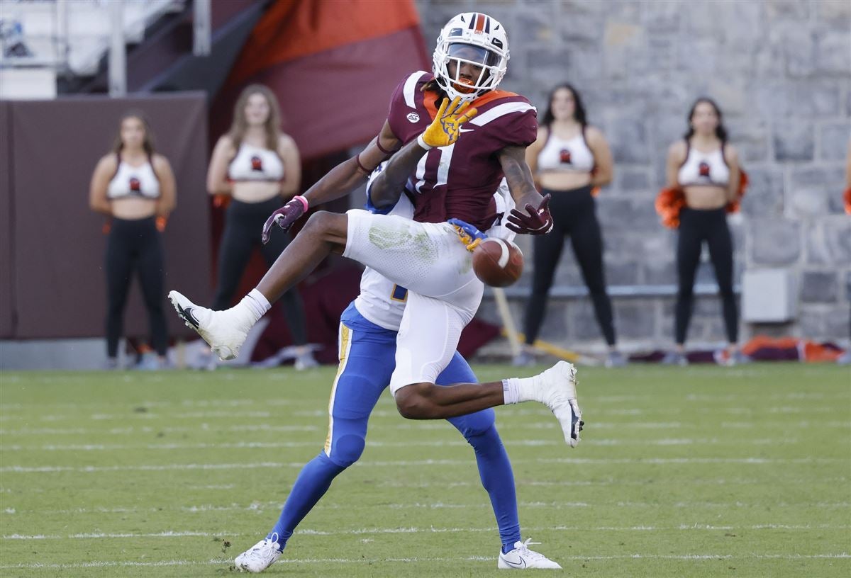 Wide receiver Tre Turner, left, crosses the finishing line while running a  20 yard shuttle runduring Virginia Tech's pro football day for NFL scouts  and coaches, Tuesday, March 22, 2022, in Blacksburg