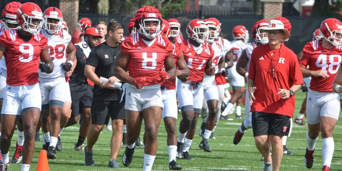 Rutgers football alum Olakunle Fatukasi and Blessuan Austin sign